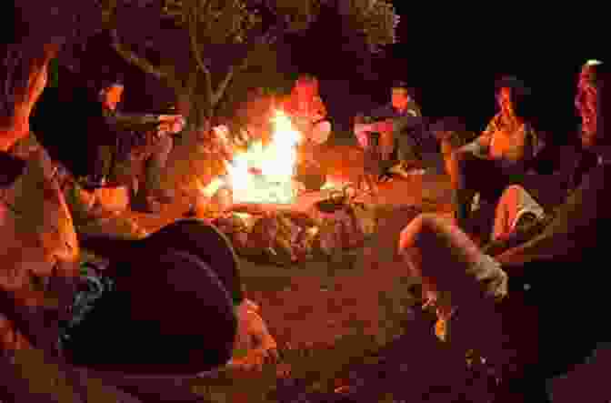 A Group Of Campers Gathered Around A Campfire In A Secluded Campsite, Surrounded By The Tranquil Sounds Of Nature 101 Travel Bits: Glacier National Park