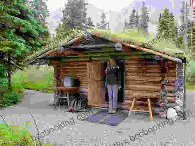 Alaska Slim Randles, A Legendary Trapper And Storyteller, Stands In Front Of A Cabin In The Alaskan Wilderness. Strange Tales Of Alaska Slim Randles