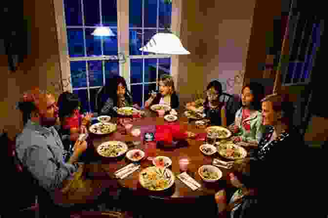 Family Sitting Together For Dinner FUNdamentals Of Parenting: 12 Fun Strategies To Build Strong Family Relationships