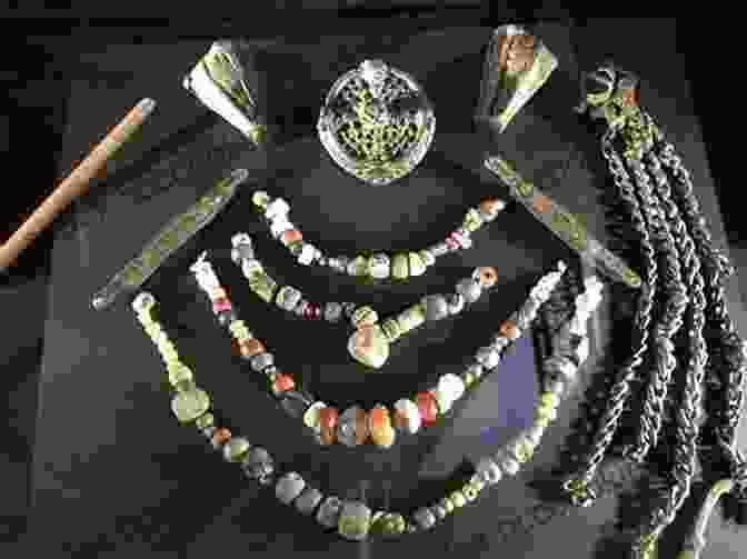 Image Of A Collection Of Viking Ornaments, Including Pendants, Beads, And Brooches, Displaying Various Symbols And Motifs. Viking Knits And Ancient Ornaments: Interlace Patterns From Around The World In Modern Knitwear